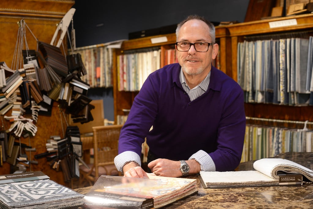 Britt Carter designing interiors in his studio