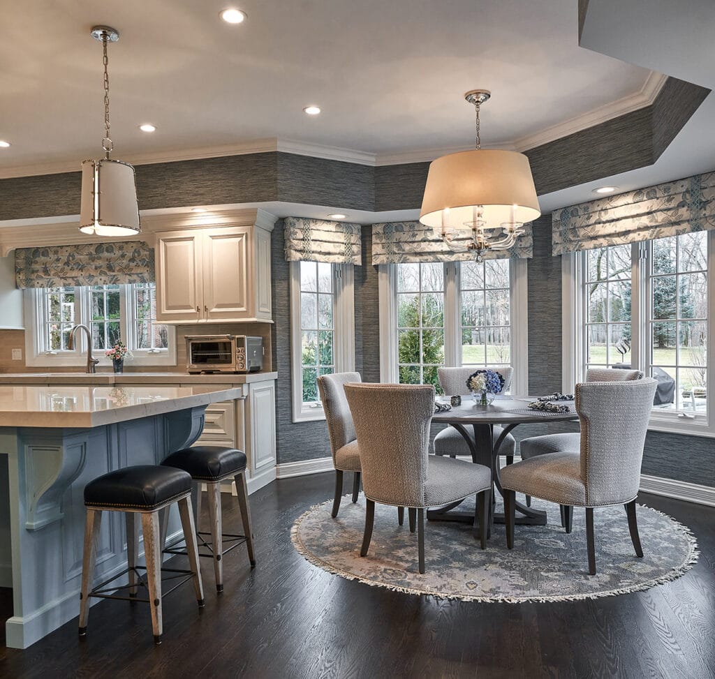 Kitchen with dining area, round table, and bay window.